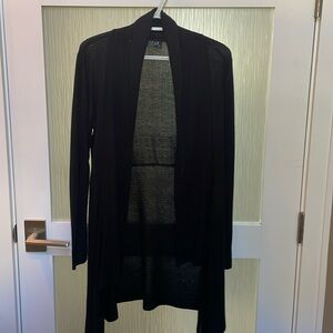 Black asymmetrical sweater duster. Mid thigh length.